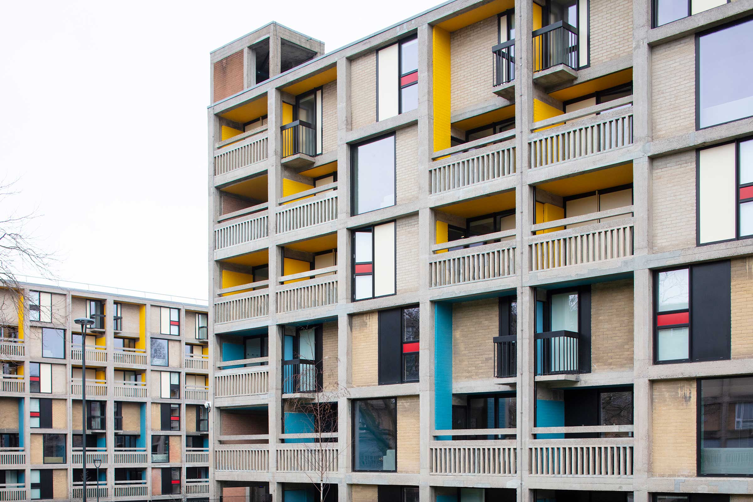 a picture of a brutalist apartment block that has been renovated with aluminium windows